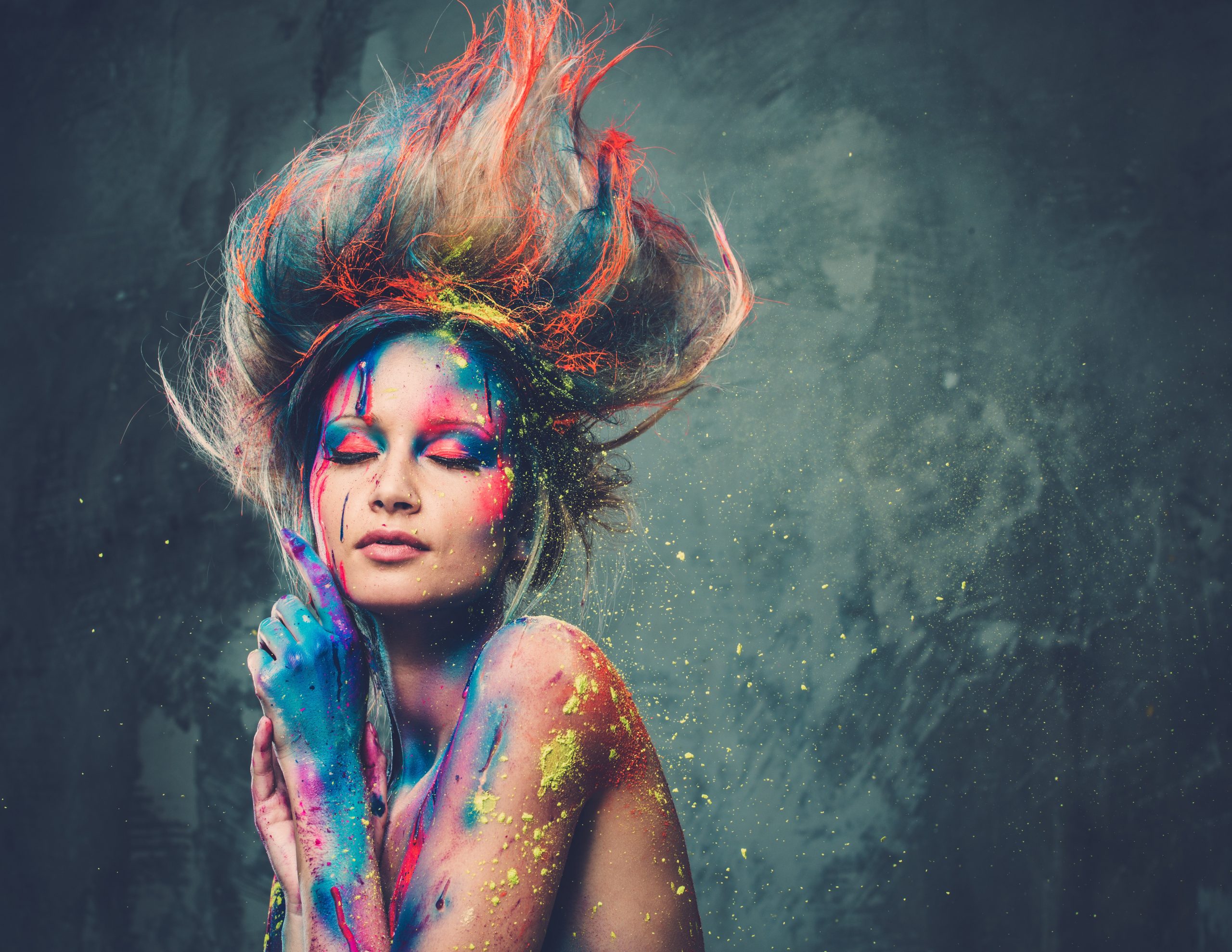 young woman muse with creative body art and hairdo